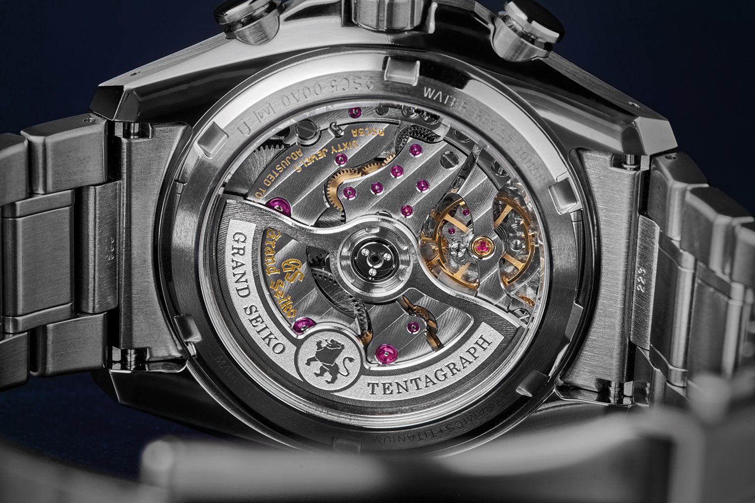 The superb base caliber with four beautifully shaped bridges visible through the sapphire case back